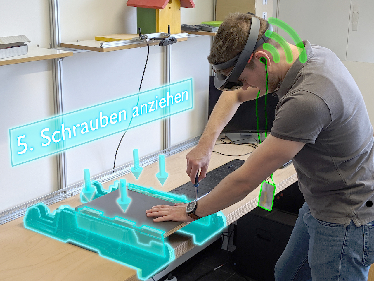 A person mounts a workpiece according to instructions via data glasses