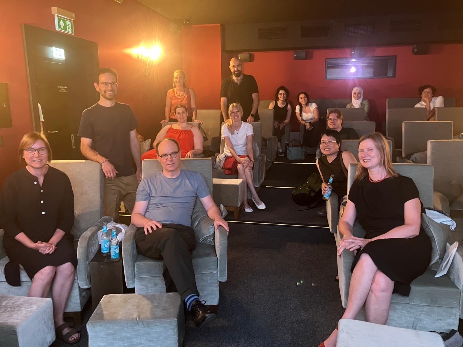 Group Picture of Members of the RTG 2951 with Director Renzo Sgolacchia in cinema screening room