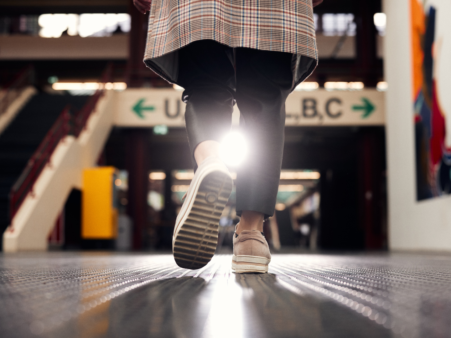 A person walking through the main hall