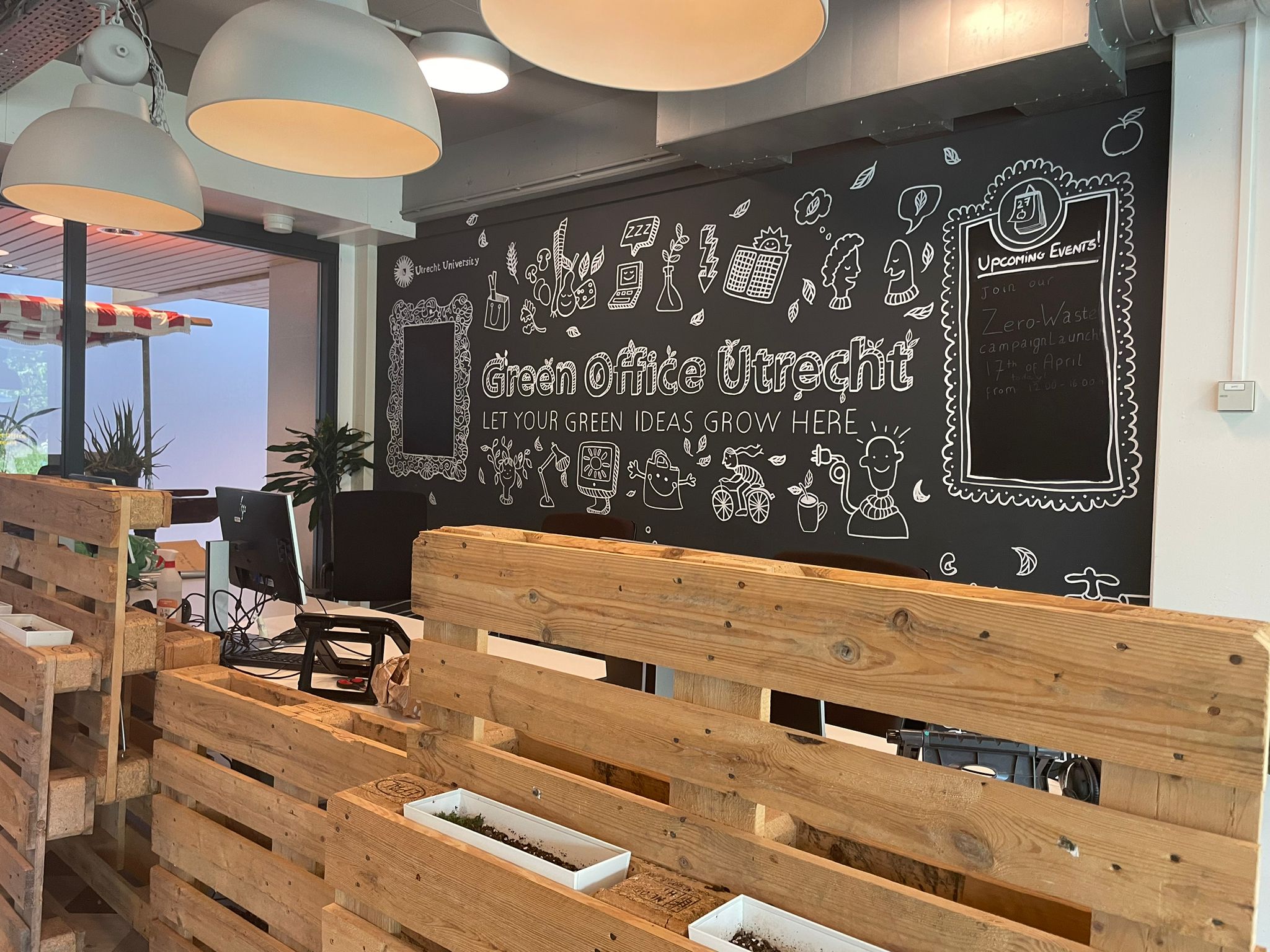 Green Office premises with blackboard in the background
