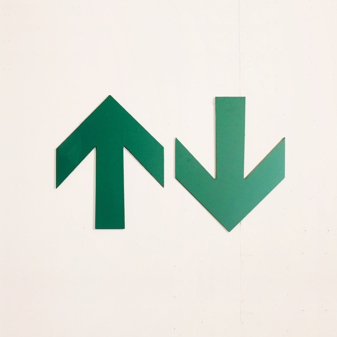 Two arrows: One pointing up and the other pointing down.