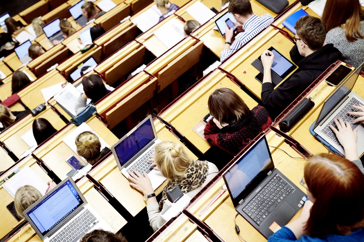 Students with laptops in the lecture hall