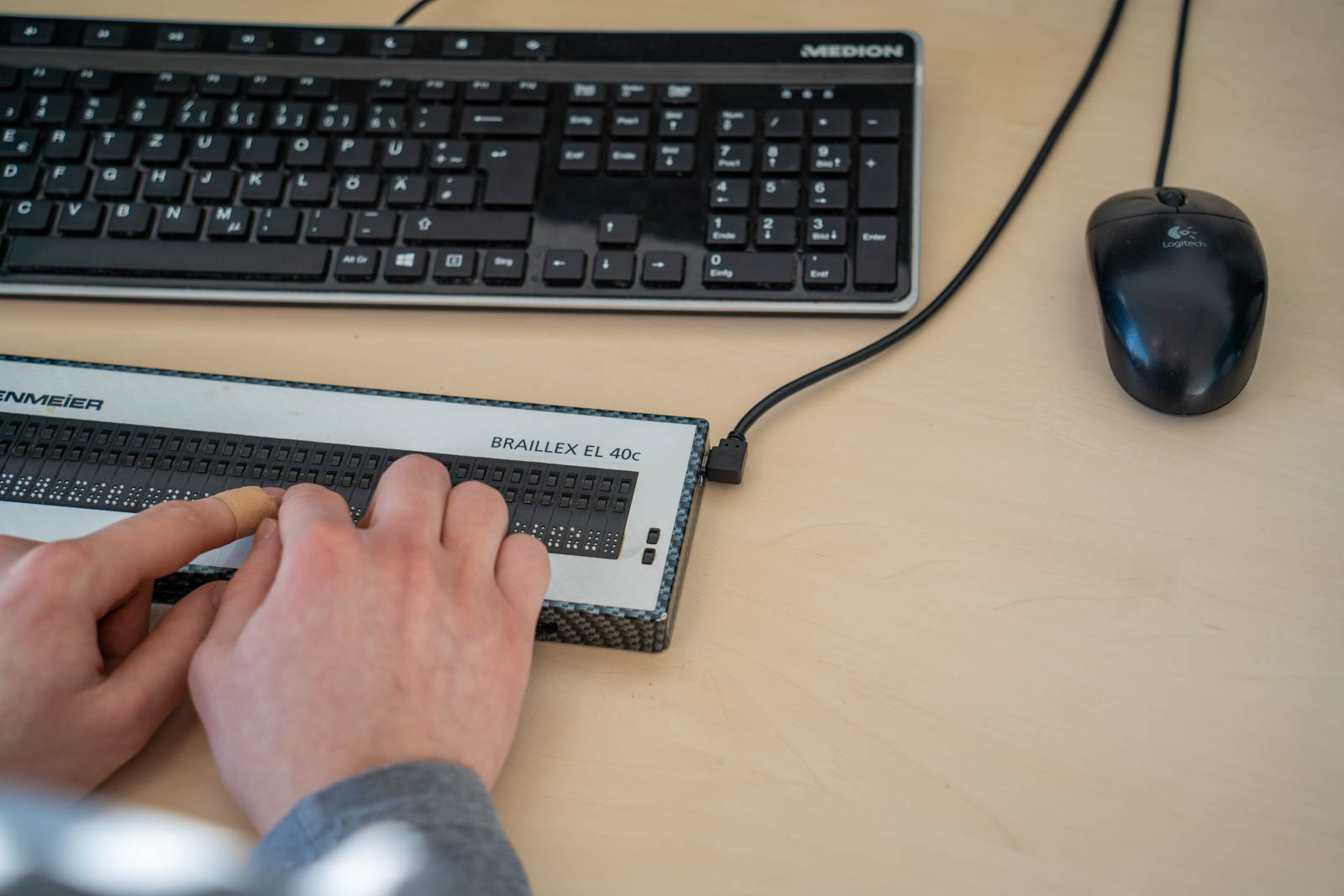 Finger on Braille keyboard