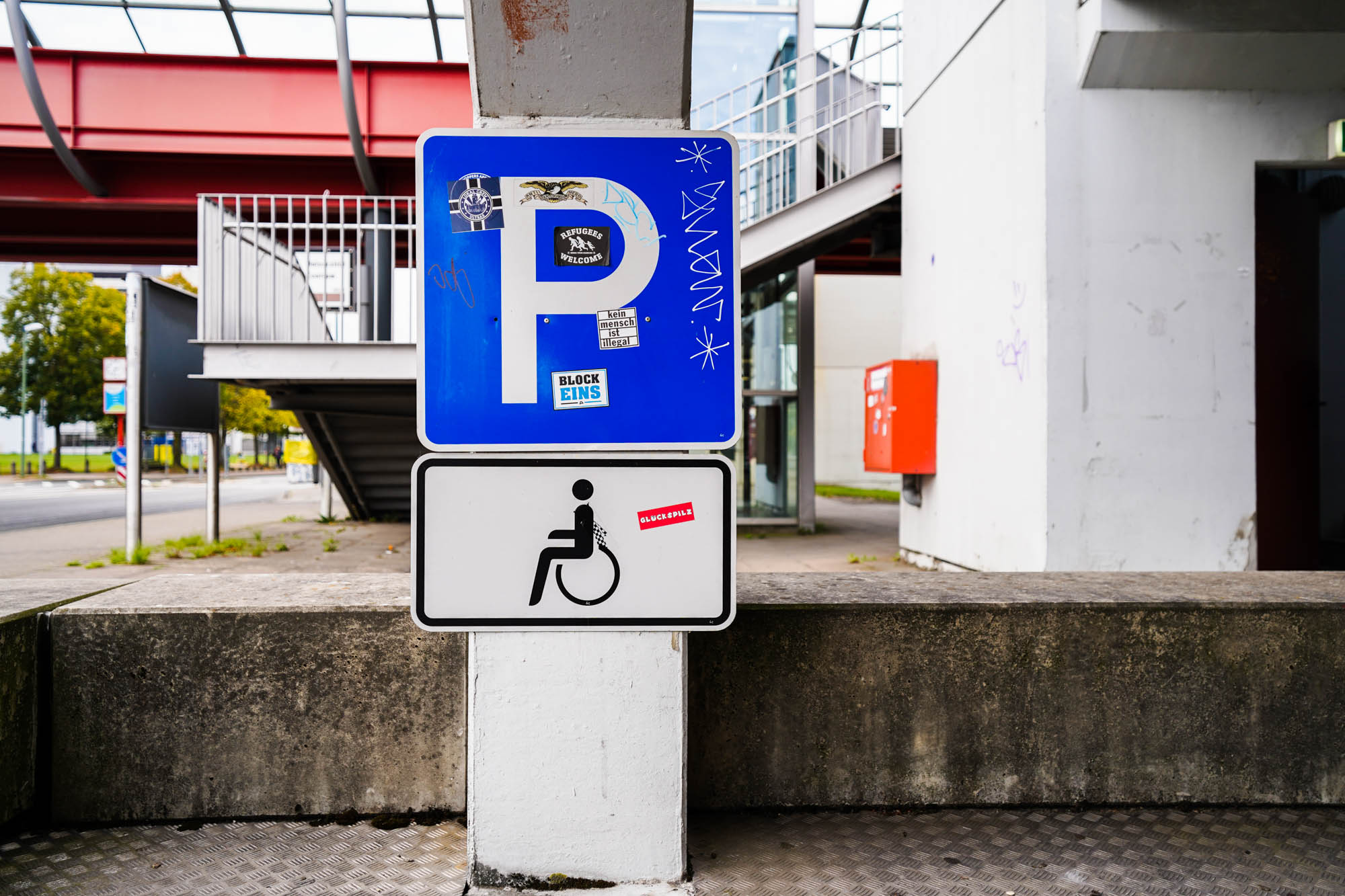 green signboard with sign wheelchair user