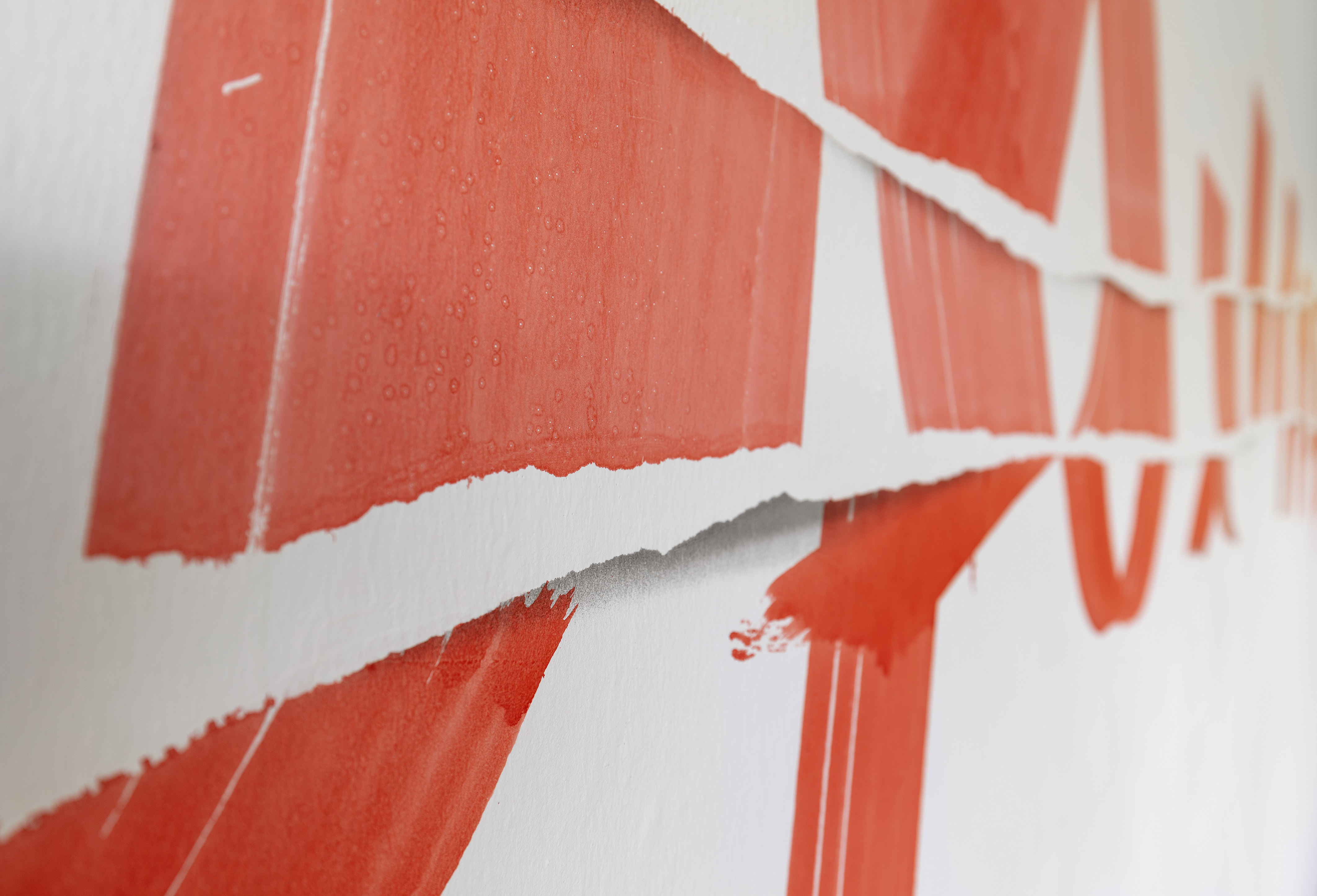 A little piece of an artwork by Friederike Feldmann, orange colour on a ZiF wall