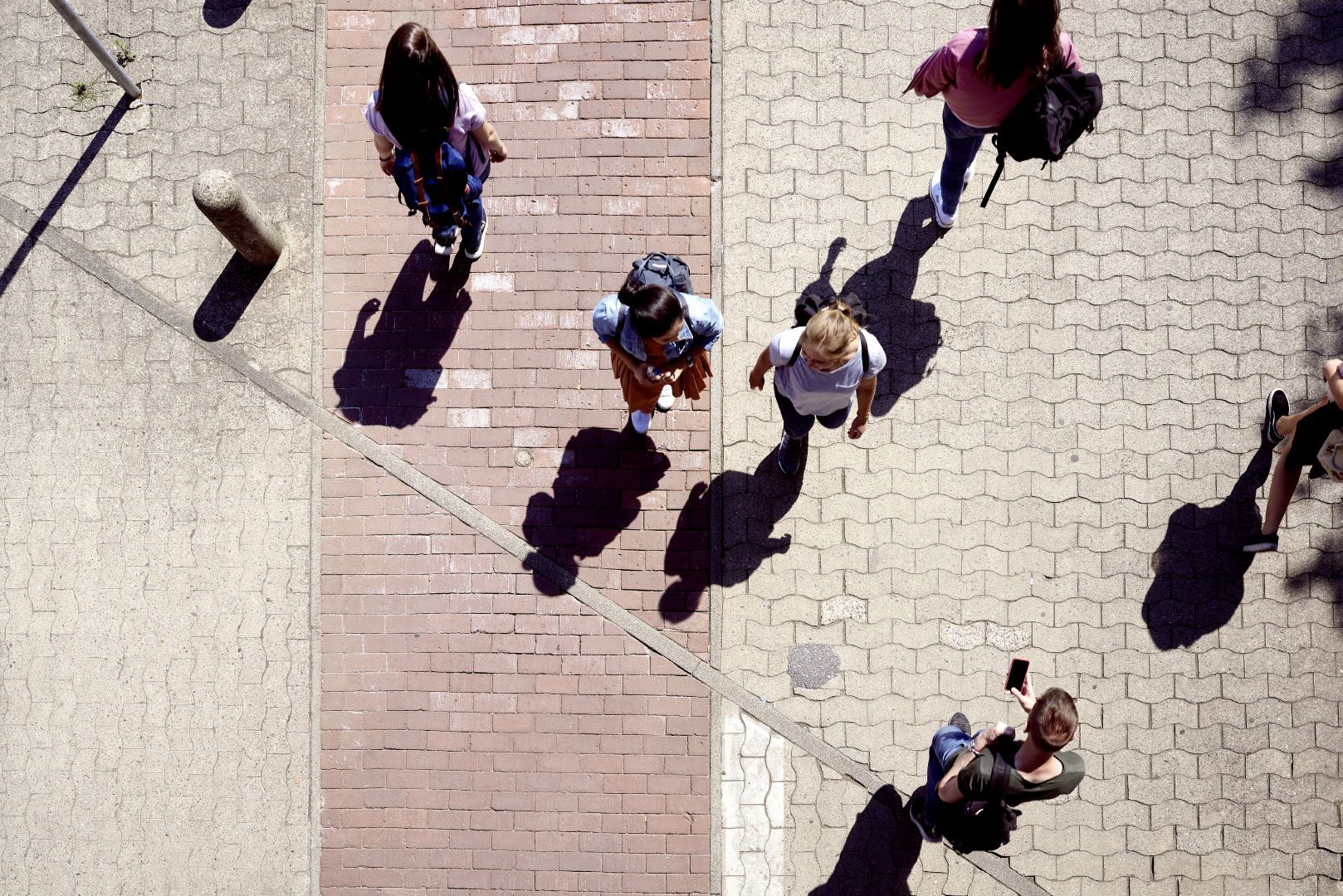 drone image of campus; people walking
