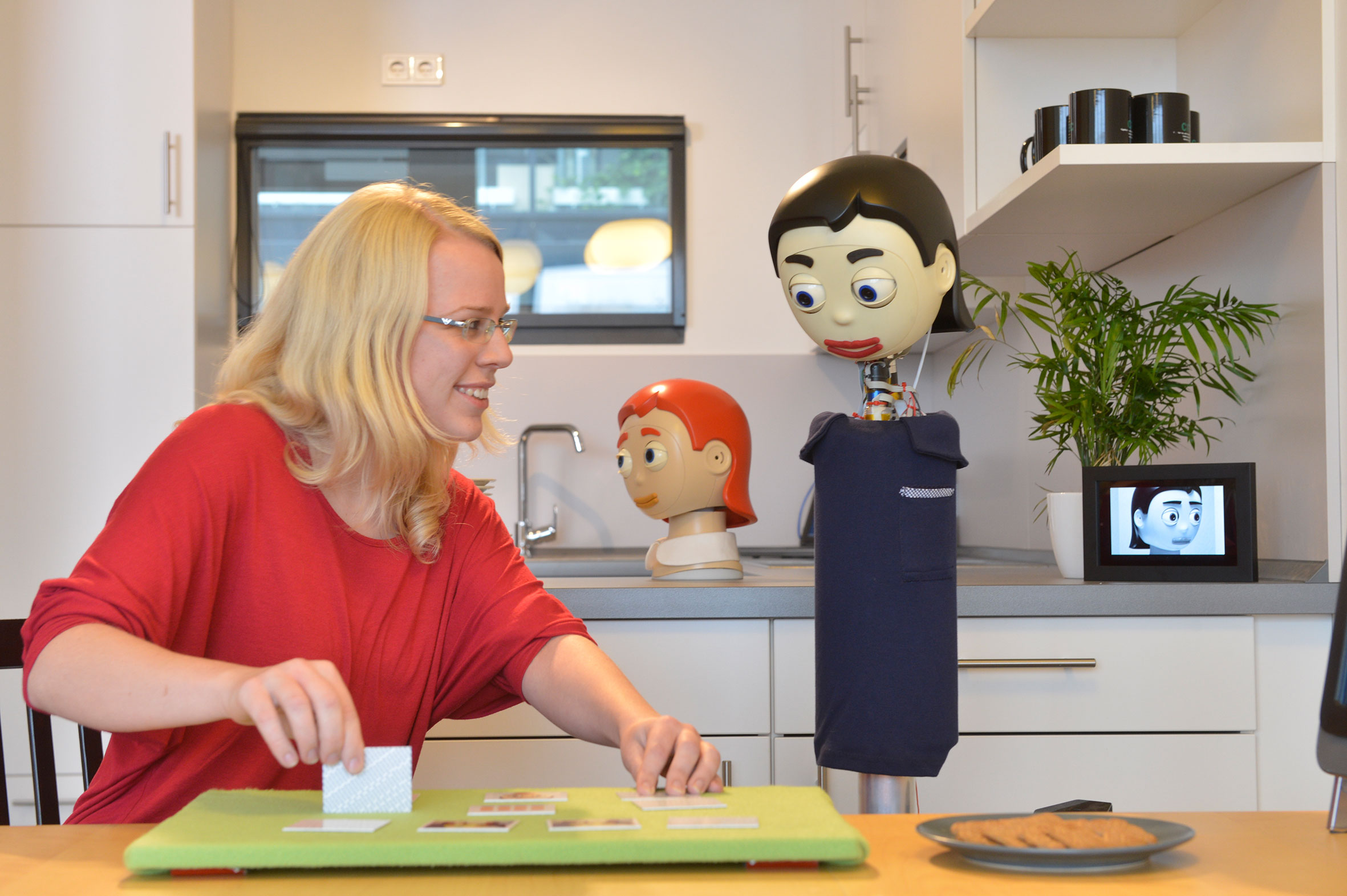 human and robot are playing a game