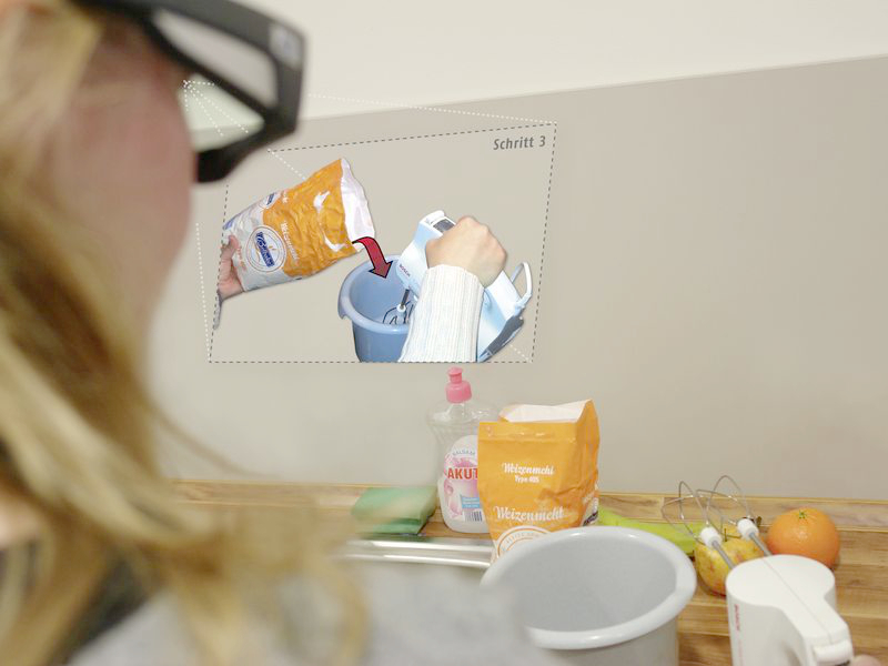 A person with data glasses mixes a dough according to instructions on the AR display