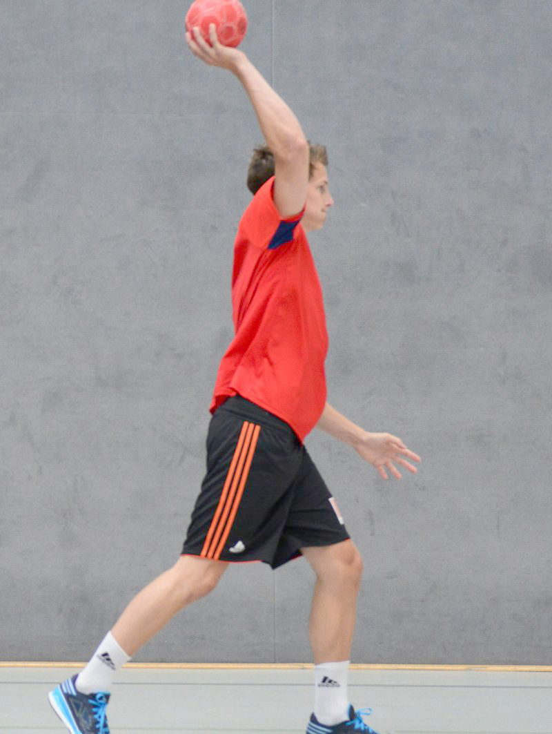 A person performs an overhand throw