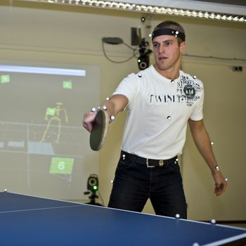 Table tennis player with optical markers