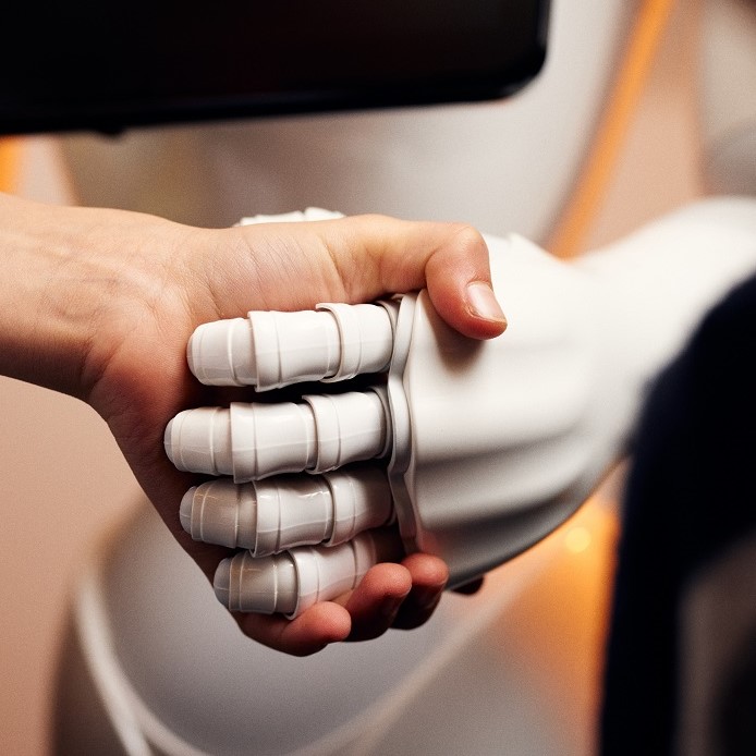 Humans shake hands with robots