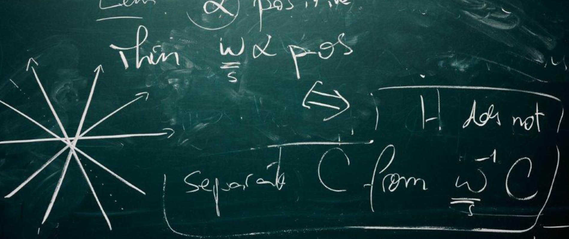 Mathematical formulas in chalk on a black board