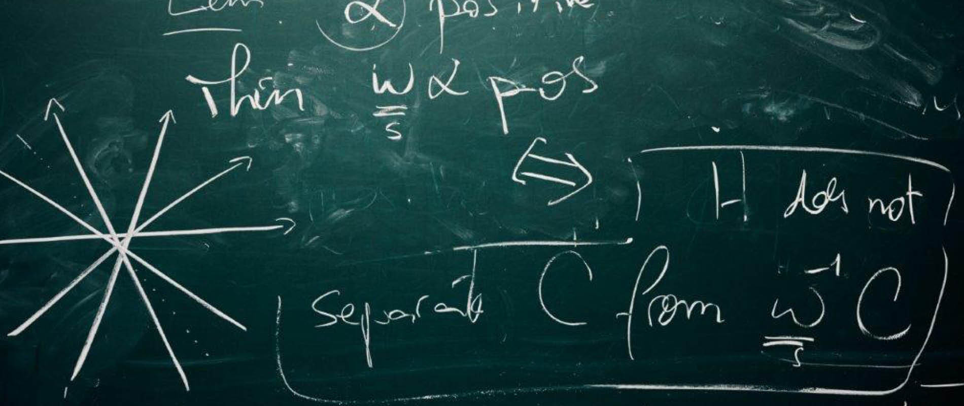 Mathematical formulas in chalk on a black board