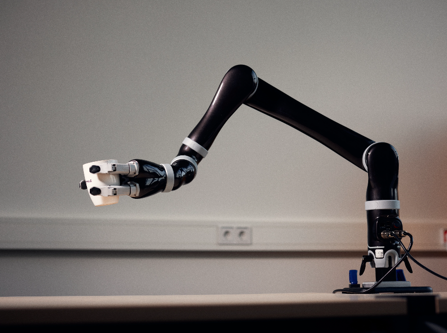 Robot arm holding a coffee cup