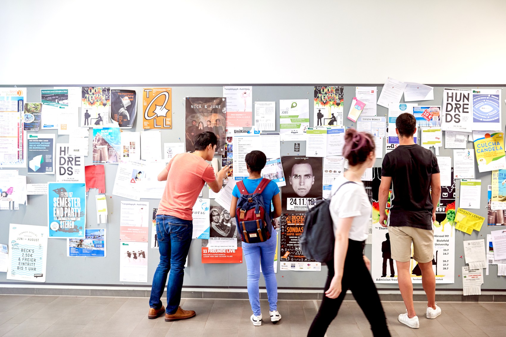 students in front of posters