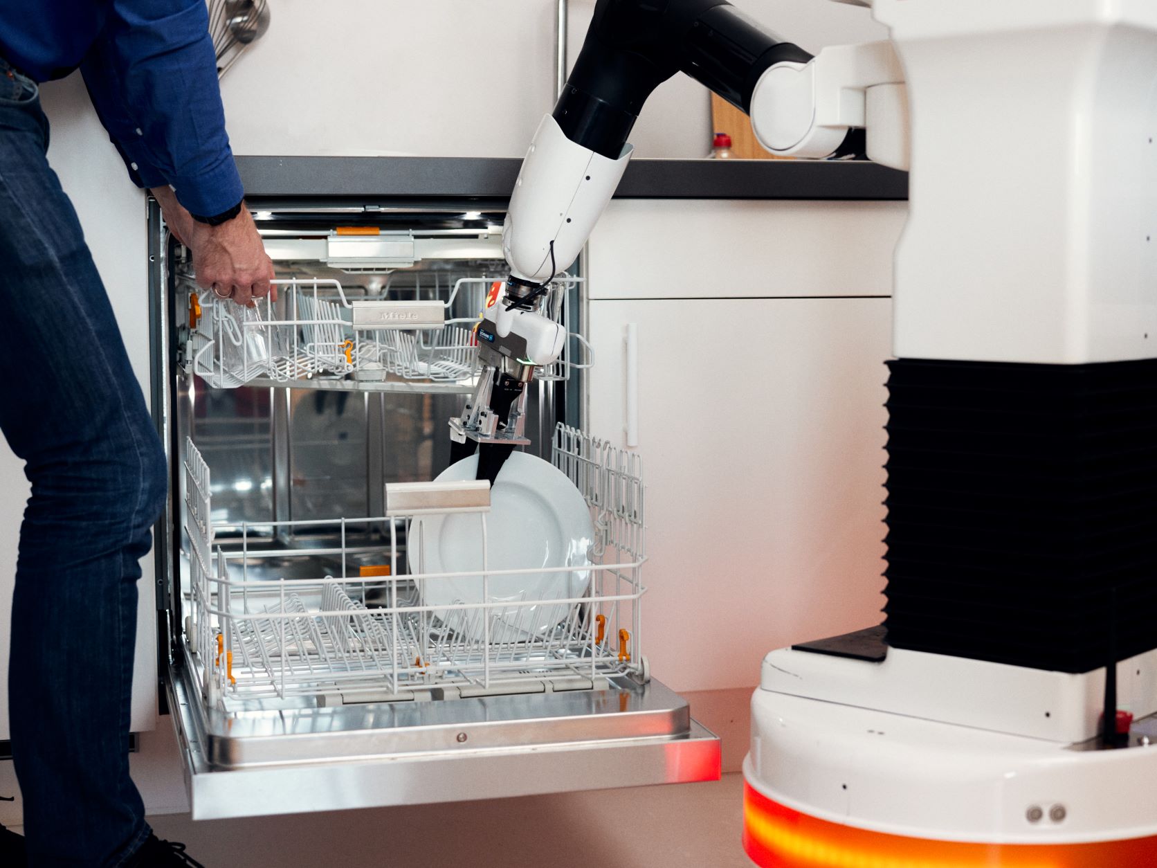 robot loads the dishwasher